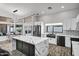 Bright kitchen featuring marble countertops, stainless steel appliances and an adjacent breakfast nook at 8913 S Forest Ave, Tempe, AZ 85284