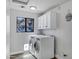 Functional laundry room featuring stacked washer and dryer at 8913 S Forest Ave, Tempe, AZ 85284