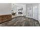 Bright and open living area with wood-style flooring and large windows with plantation shutters at 8913 S Forest Ave, Tempe, AZ 85284