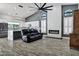 Bright living room featuring a modern electric fireplace, a comfortable sofa, and an open floorplan at 8913 S Forest Ave, Tempe, AZ 85284