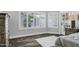 Bright bedroom with white shutters and hardwood floors at 8913 S Forest Ave, Tempe, AZ 85284