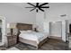Comfortable main bedroom featuring hardwood floors, ceiling fan, and nightstands at 8913 S Forest Ave, Tempe, AZ 85284