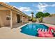 Sparkling pool with comfortable lounge chairs for relaxation at 8913 S Forest Ave, Tempe, AZ 85284