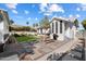 Landscaped backyard with pavers, dining space, fresh green grass, and well-maintained plants at 905 E Coronado Rd, Phoenix, AZ 85006