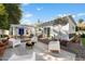 Inviting backyard with modern outdoor seating, fire pit, and lush landscaping at 905 E Coronado Rd, Phoenix, AZ 85006