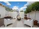 Private backyard featuring an inviting fire pit surrounded by lounge chairs and trees at 905 E Coronado Rd, Phoenix, AZ 85006