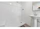 Clean white bathroom features a walk-in shower and sink with neutral tiled walls at 905 E Coronado Rd, Phoenix, AZ 85006