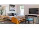 Bright bedroom with striped rug, decorative art, comfy bed, and desk area at 905 E Coronado Rd, Phoenix, AZ 85006