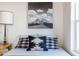 Bright bedroom with accent wall, patterned bedding, and stylish bedside lamp at 905 E Coronado Rd, Phoenix, AZ 85006