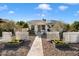 Charming single-story home featuring a well-manicured front yard and a welcoming walkway to the front door at 905 E Coronado Rd, Phoenix, AZ 85006