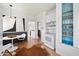 Kitchen with butcher block countertops, white cabinets, black and white wainscoting, and blue shelving at 905 E Coronado Rd, Phoenix, AZ 85006