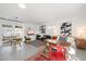 Open living space featuring a dining area, seating, and a cozy bed with decorative artwork at 905 E Coronado Rd, Phoenix, AZ 85006