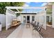 Beautiful patio with a pergola, comfortable seating, and an outdoor television for relaxation and entertainment at 905 E Coronado Rd, Phoenix, AZ 85006