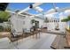 Stylish outdoor patio features a pergola, modern furniture, and striped concrete, perfect for entertaining at 905 E Coronado Rd, Phoenix, AZ 85006