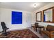 Sitting room with neutral walls, a dark brown patterned area rug, wall art, and wood trimmed mirrors at 905 E Coronado Rd, Phoenix, AZ 85006