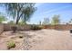 Spacious backyard with desert landscaping and a decorative rock bed is perfect for outdoor living at 93 S Sandstone St, Gilbert, AZ 85296