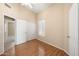 Bedroom featuring wood floors, ceiling fan, and natural light at 93 S Sandstone St, Gilbert, AZ 85296