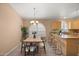 Cozy dining area adjacent to the kitchen, featuring a stylish table setting and ample natural light at 93 S Sandstone St, Gilbert, AZ 85296