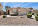 Charming single-story home boasts a well-kept yard with desert landscaping and a cozy front entrance at 93 S Sandstone St, Gilbert, AZ 85296