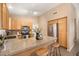 Well-equipped kitchen with granite countertops, stainless steel appliances, breakfast bar, and ample cabinet space at 93 S Sandstone St, Gilbert, AZ 85296
