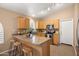 Functional kitchen features granite countertops, stainless steel appliances, ample cabinet space, and a convenient breakfast bar at 93 S Sandstone St, Gilbert, AZ 85296