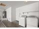 Bright laundry room with a full-size washer and dryer and ample space for folding and storage at 93 S Sandstone St, Gilbert, AZ 85296