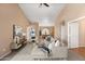 Open concept living room showcases high ceilings, neutral decor, tile floors, and comfortable seating arrangements at 93 S Sandstone St, Gilbert, AZ 85296