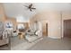 Inviting living space with high ceilings, tile flooring, and seamless transitions to dining and kitchen areas at 93 S Sandstone St, Gilbert, AZ 85296