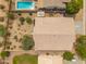 Aerial view shows backyard landscaping including pool, patio, and desert landscaping at 1029 E Ian Dr, Phoenix, AZ 85042