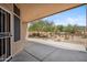 Covered back patio providing a serene view of the desert landscaping and the open backyard at 1029 E Ian Dr, Phoenix, AZ 85042