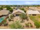 Aerial view of desert landscaped backyard featuring a pool and covered patio at 1029 E Ian Dr, Phoenix, AZ 85042