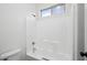 Bathroom with a tub/shower combo, showcasing a clean and functional design at 1029 E Ian Dr, Phoenix, AZ 85042