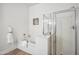 Bright bathroom showing a tub with jets and a shower with glass doors, enhancing the space's appeal at 1029 E Ian Dr, Phoenix, AZ 85042