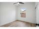 Well-lit bedroom featuring a window and ceiling fan, creating a comfortable and inviting atmosphere at 1029 E Ian Dr, Phoenix, AZ 85042