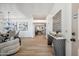Inviting entryway with modern decor, hardwood floors, and a view into the dining and living spaces at 1029 E Ian Dr, Phoenix, AZ 85042