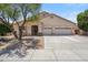 Charming single-story home featuring a three-car garage and well-maintained desert landscaping at 1029 E Ian Dr, Phoenix, AZ 85042