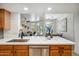 Kitchen island with stainless steel dishwasher overlooking dining and living area at 1029 E Ian Dr, Phoenix, AZ 85042