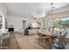Open concept living space with dining area, featuring modern decor, lots of seating and natural light at 1029 E Ian Dr, Phoenix, AZ 85042