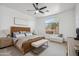 Main bedroom featuring a decorative headboard, bench, and natural light at 1029 E Ian Dr, Phoenix, AZ 85042