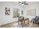 Bright office featuring a desk, chairs, and artwork, creating a functional and stylish workspace at 1029 E Ian Dr, Phoenix, AZ 85042