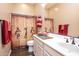 Bathroom features an ethnic shower curtain and a white sink at 10507 S 181St Ave, Goodyear, AZ 85338