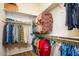 A spacious walk-in closet with custom shelving and ample hanging space for organized storage at 10507 S 181St Ave, Goodyear, AZ 85338