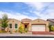 Charming single-story home featuring a tile roof, desert landscaping, and a two-car garage at 10507 S 181St Ave, Goodyear, AZ 85338