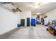 Spacious two car garage with ample storage and a ceiling fan providing convenience and functionality at 10507 S 181St Ave, Goodyear, AZ 85338
