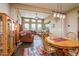 Open-concept living and dining area with wood floors, ample natural light, and comfortable seating at 10507 S 181St Ave, Goodyear, AZ 85338
