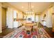 Open-concept kitchen and living space with a dining area and wood-style flooring at 10507 S 181St Ave, Goodyear, AZ 85338