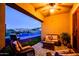 Inviting outdoor living space features comfortable seating, fire feature, and a view of the sparkling pool and picturesque mountain views at 10507 S 181St Ave, Goodyear, AZ 85338