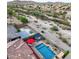 Aerial view of a private pool with a pergola and desert landscaping in a gated community with mountain views at 10507 S 181St Ave, Goodyear, AZ 85338