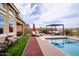 An inviting backyard with pool, lounge chairs, and a covered pergola at 10507 S 181St Ave, Goodyear, AZ 85338