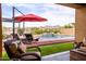 Gorgeous backyard features a pool with a waterfall and mountain views at 10507 S 181St Ave, Goodyear, AZ 85338